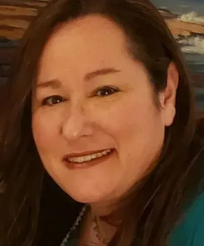 Portrait of a warm, smiling therapist